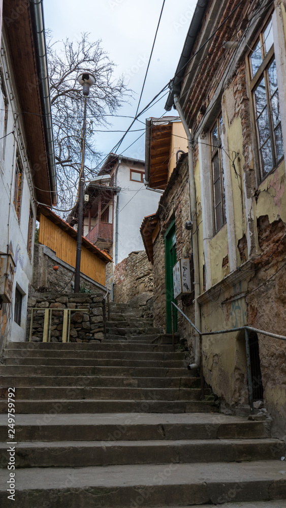 narrow old pedestrian street of Veliko Tarnovo in Bulgaria with old houses and stairs