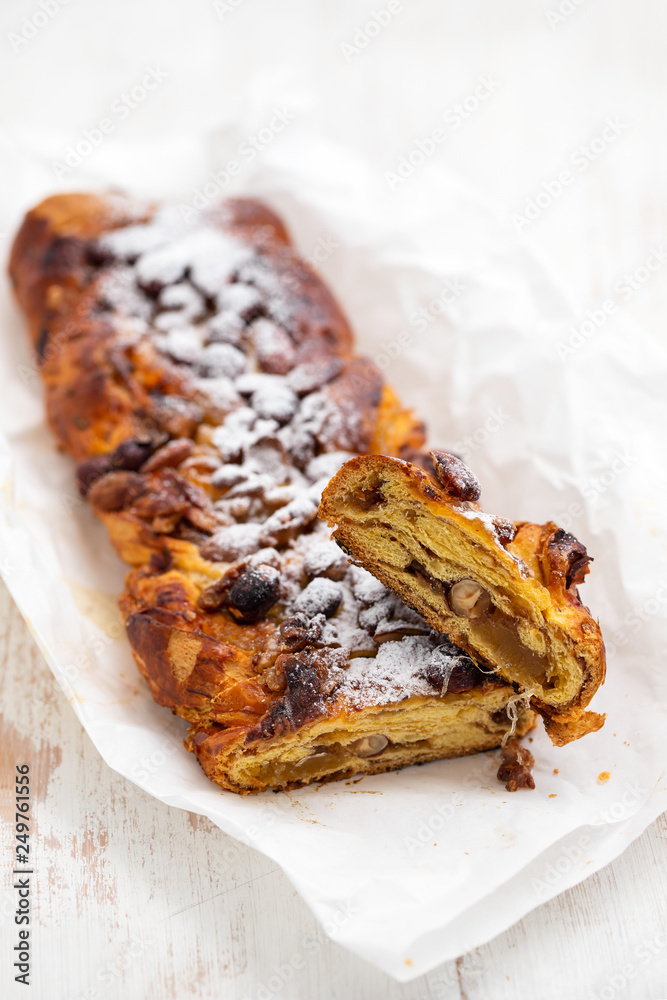 cake with dry fruits and canned sugar on white paper cake with dry fruits and canned sugar on white paper
