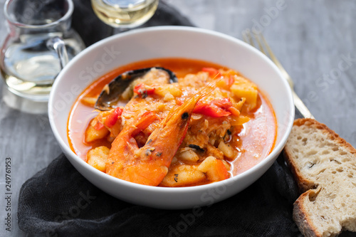 typical portuguese fish and seafood stew caldeirada in dish on ceramic background