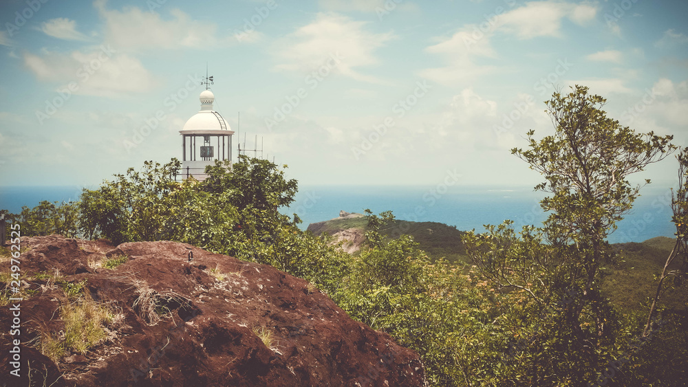 Lighthouse on the top of a island's hill