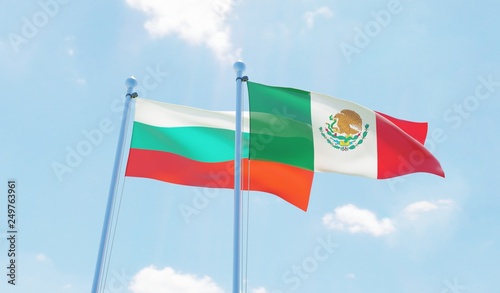 Mexico and Bulgaria, two flags waving against blue sky. 3d image