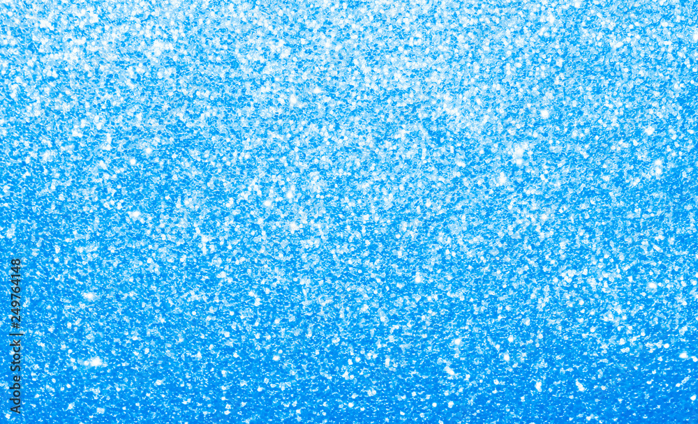 Light baby blue, glitter, sparkle and shine abstract background