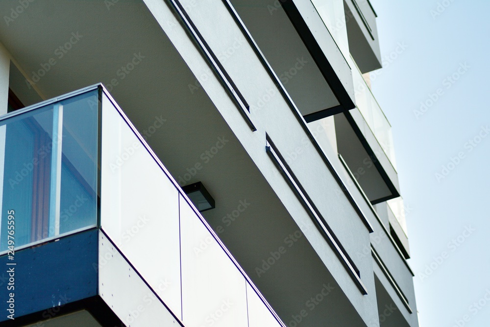 Modern apartment buildings on a sunny day with a blue sky. Facade of a modern apartment building Modern apartment buildings on a sunny day with a blue sky. Facade of a modern apartment building