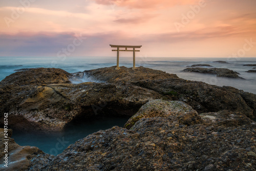 Torii gate and the ocean photo