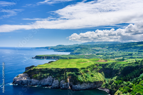 the cliff and the ocean, panorama of the coast in azores islands. portugal photo