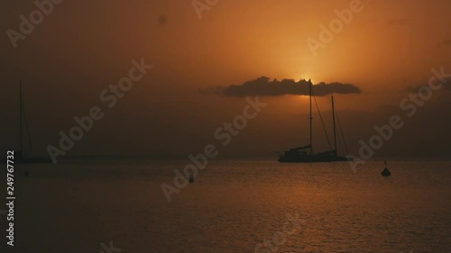 Boat on a beautiful sunset in the Caribbean photo