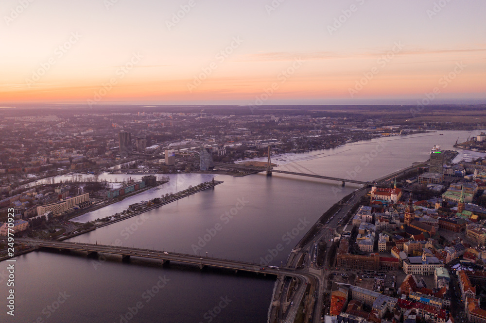 Fototapeta Aerial view of winter Riga during purple sunset view.