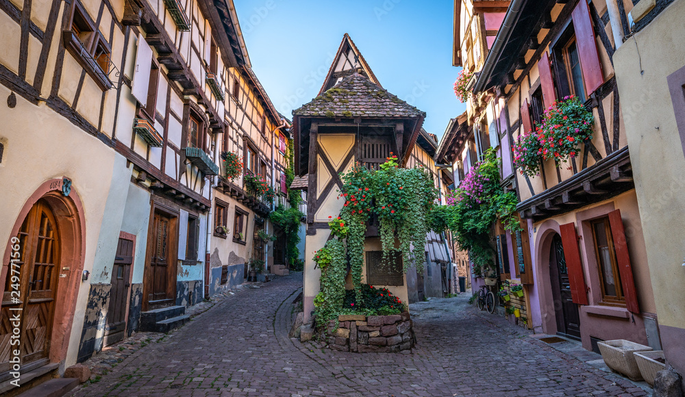 Colorful medieval half timbered buildings in Alsatian village France.