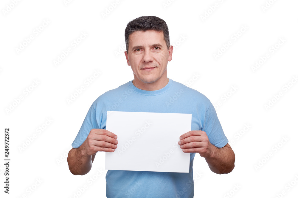 Senior man holds blank paper sheet in two hands and smiling. Senior man holds blank paper sheet in two hands and smiling.