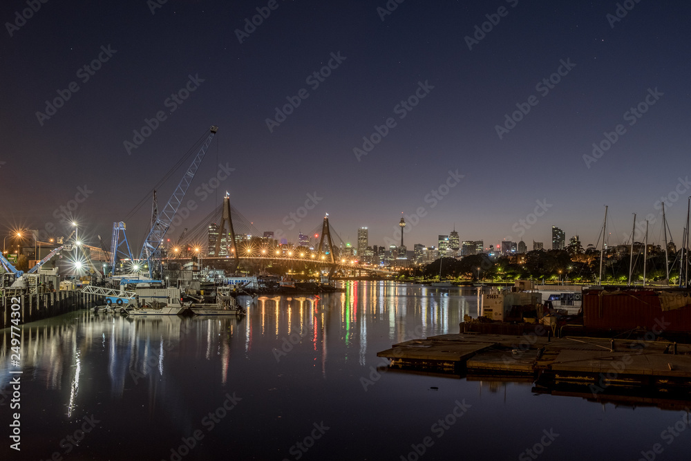 Sydney city and NZAC Bridge at dawn