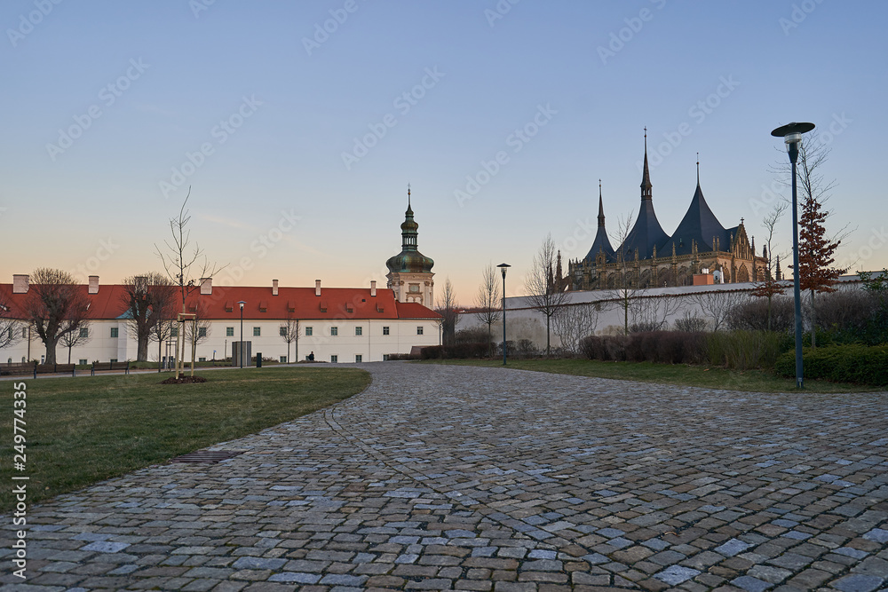 Naklejka premium Jesuit college in Kutna Hora in Czech republic, Europe with famous cathedral of Saint Barbara build in gothic style in sunset. City is member of world heritage Unesco.