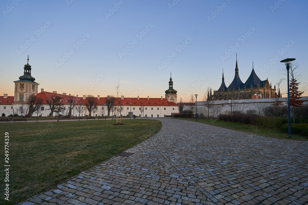 Jesuit college in Kutna Hora in Czech republic, Europe with famous cathedral of Saint Barbara build in gothic style in sunset. City is member of world heritage Unesco.