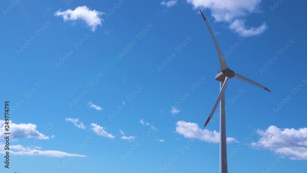 large wind turbine on blue sky large wind turbine on blue sky