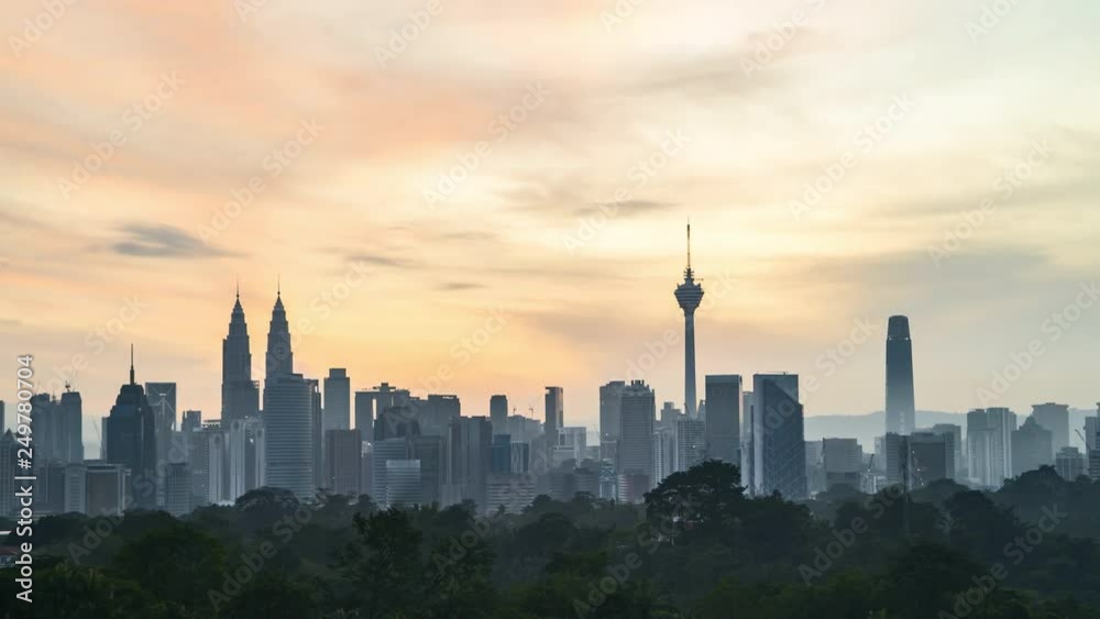 4k time lapse of sunrise over horizon of Kuala Lumpur city skyline. Pan right 4k time lapse of sunrise over horizon of Kuala Lumpur city skyline. Pan right