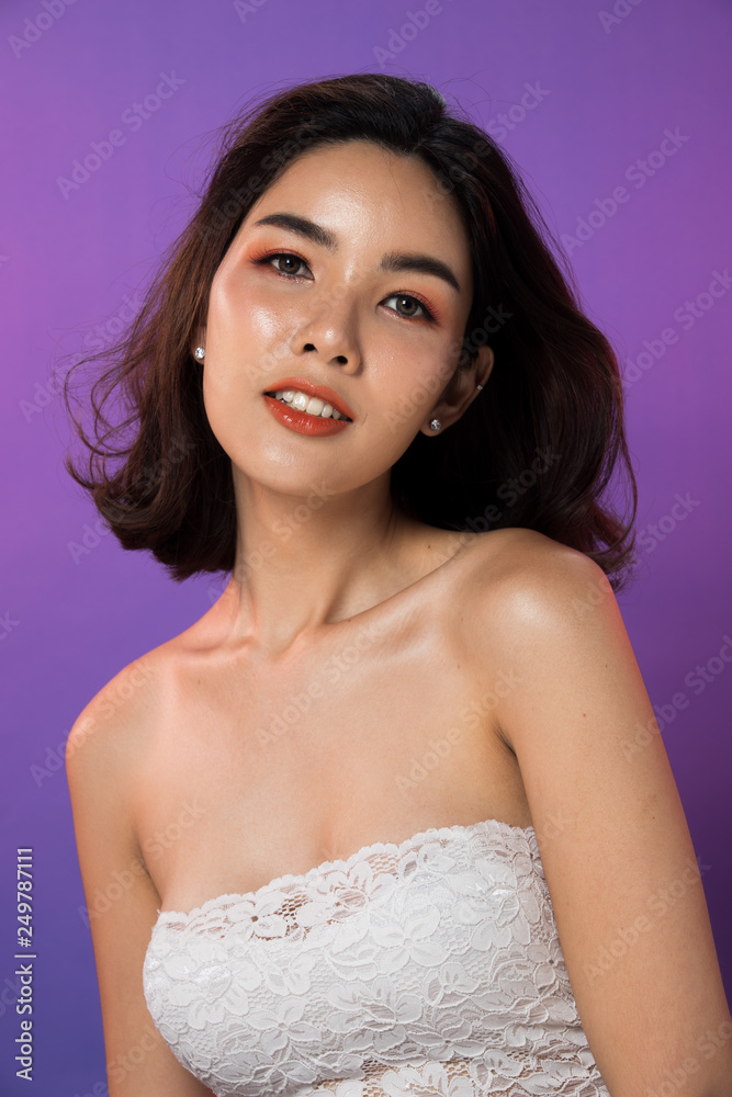 Portrait Snap Figure, Business woman Stand in gray Formal Suit, studio lighting gradient purple background, Asian 20s female Model with face eyes hands arm happy smile look attractive Portrait Snap Figure, Business woman Stand in gray Formal Suit, studio lighting gradient purple background, Asian 20s female Model with face eyes hands arm happy smile look attractive