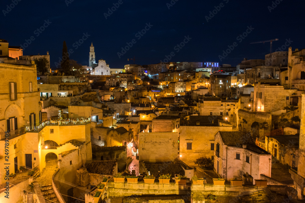 The City of Matera Lightened at Night on Blurred Background