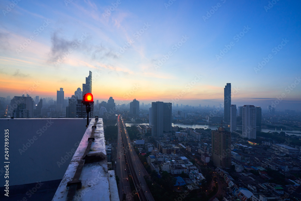 top view of rooftop building in sunrise skyline with cityscape view