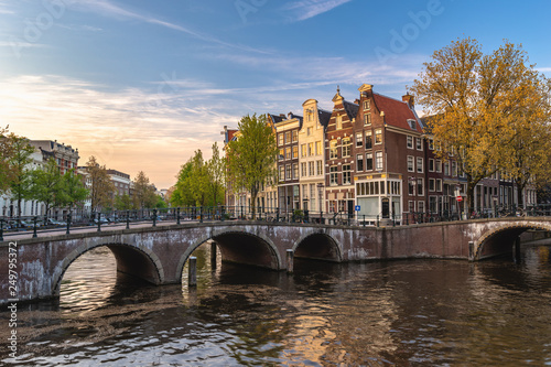 Amsterdam Netherlands, city skyline Dutch house at canal waterfront