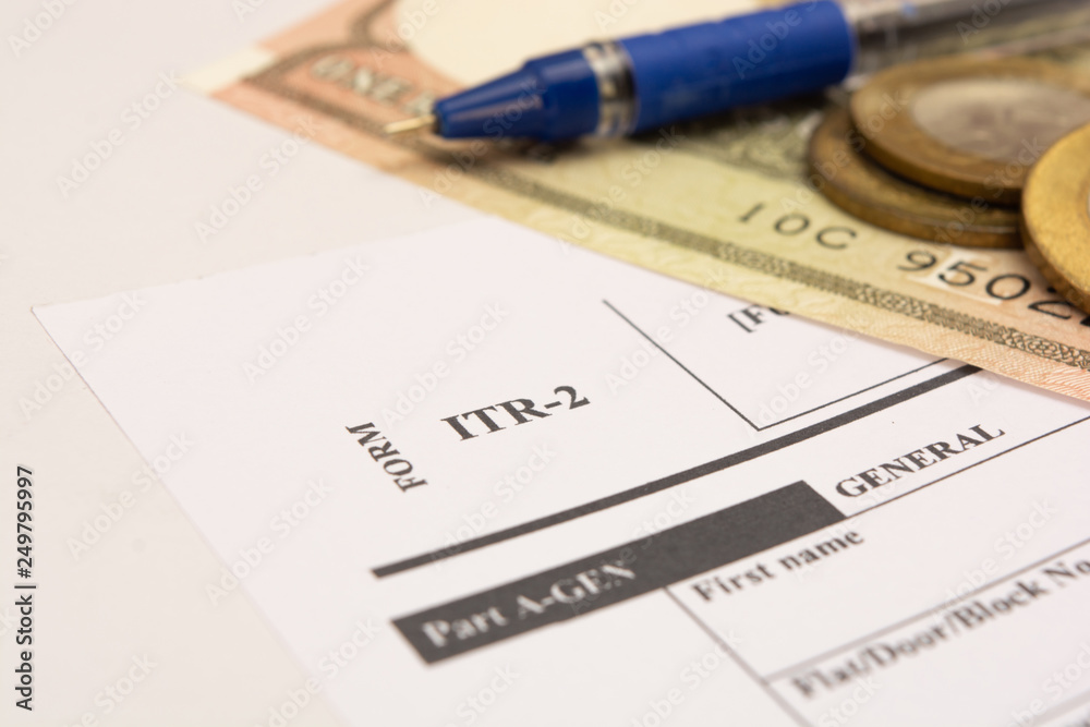 New Indian Taxation From ITR-2 Income tax Form with indian currency on isolated background New Indian Taxation From ITR-2 Income tax Form with indian currency on isolated background