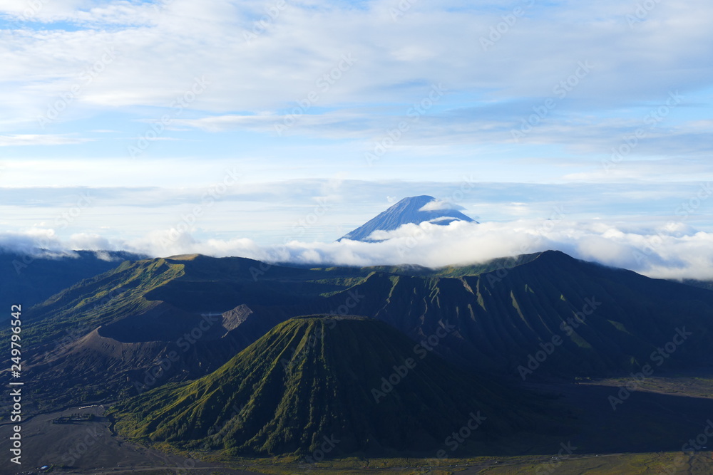 The delightful volcanic complex Bromo Tengger Semeru National Park against the background of fascinating views of nature, sky, craters and clouds