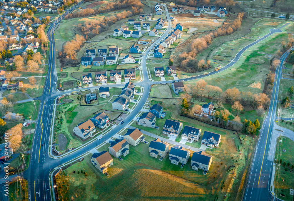 Aerial view of new construction single family home neighborhood with grand houses in Maryland real estate development