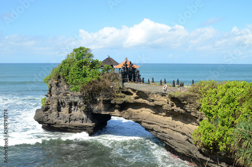 Pura Batu Bolong in the rock in Bali, Indonesia photo