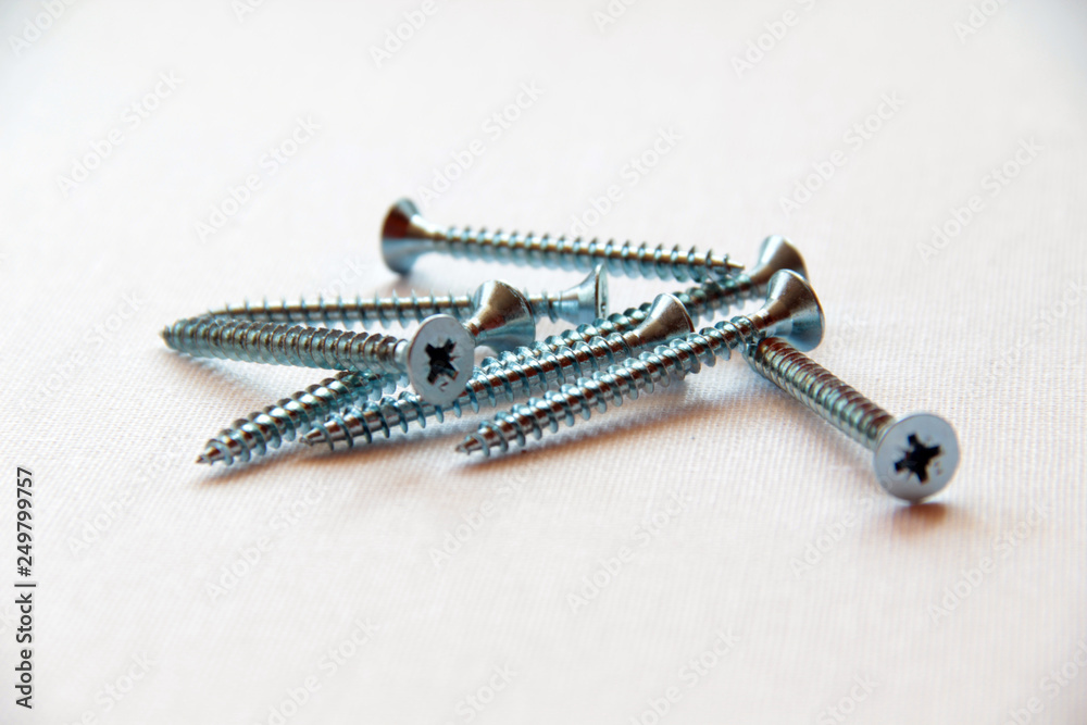 Hardware screws nails for construction on a white background Hardware screws nails for construction on a white background