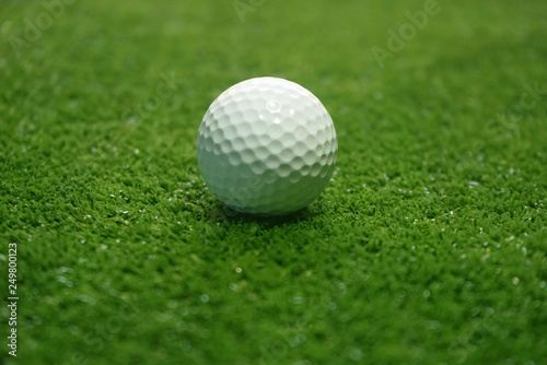 golf ball on green in beautiful golf course with sunset. Golf ball close up in golf coures at Thailand