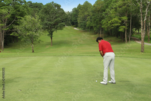 Golfers are putting golf in the evening golf course golf backglound in Thailand