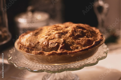 Delicious homemade apple pie dessert on white glass dish