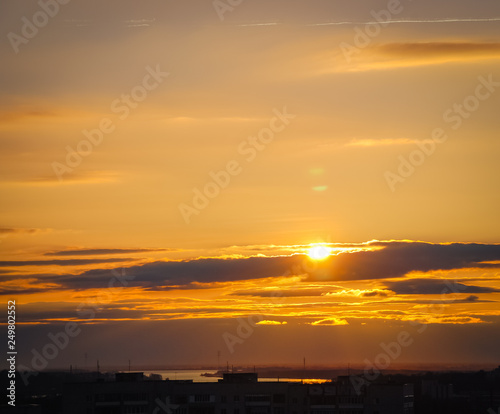 Beautiful sunset with a sun and clouds 