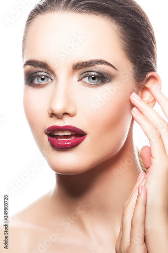 Close-up fashion model woman face with red lips make-up  smokey eyes eye shadow  clean skin  blue eyes