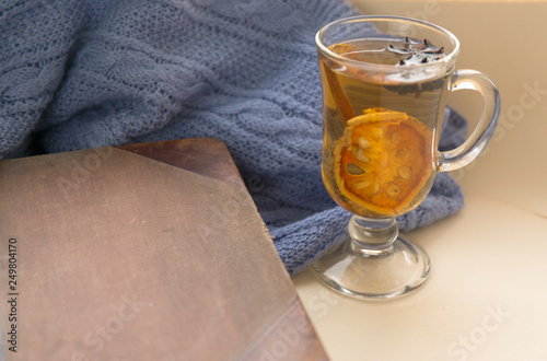 Winter warm tea with spice. Antique notebook. Knitted blanked. photo