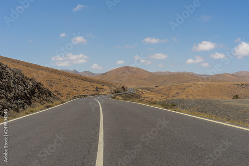 Road in the mountains  on a Canarian island  Fuerteventura with blue sky