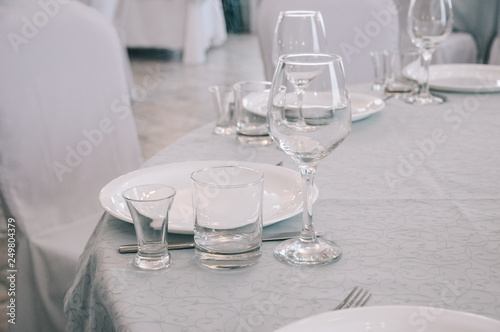 Empty white dinner plate on a table © Iliin