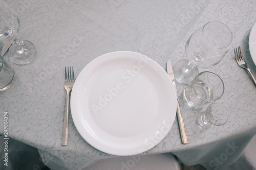 Empty white dinner plate on a table