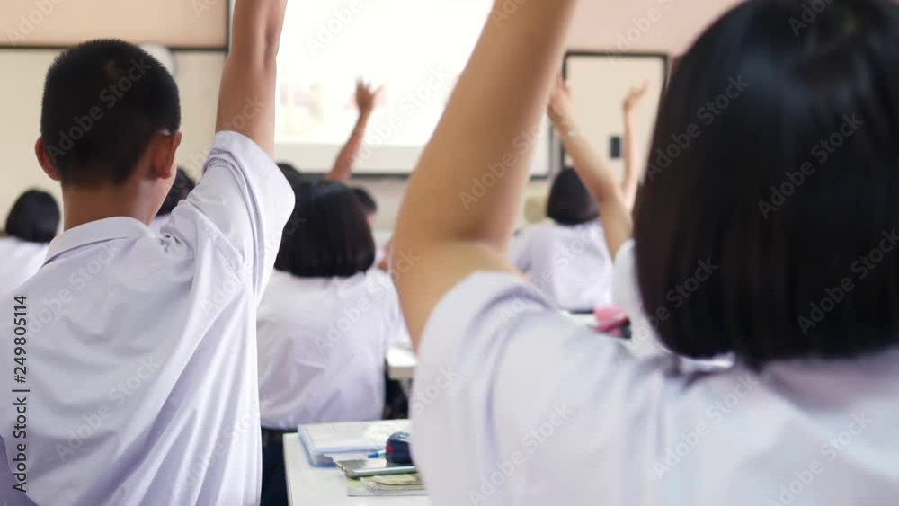 High school students are actively studying science by raising their hands to answer questions that teachers ask them, Thailand, southeast Asia.. High school students are actively studying science by raising their hands to answer questions that teachers ask them, Thailand, southeast Asia..