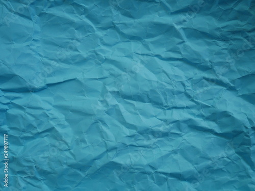 crumpled blue paper background