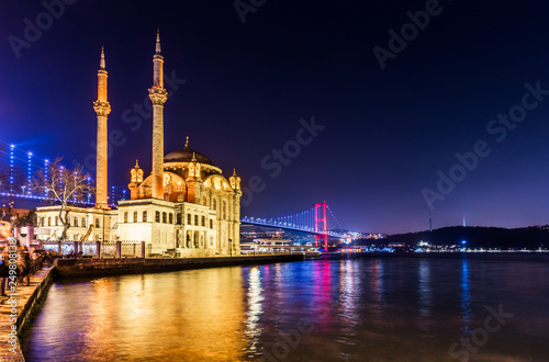 Ortakoy Mosque and Bosphorus Bridge (15th July Martyrs Bridge) night view. Istanbul, Turkey. photo