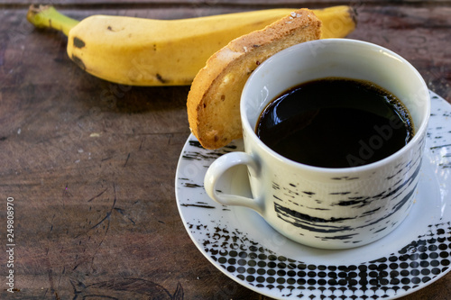 Fresh Banana, Toast and hot coffee on wooden background,breakfast or meal