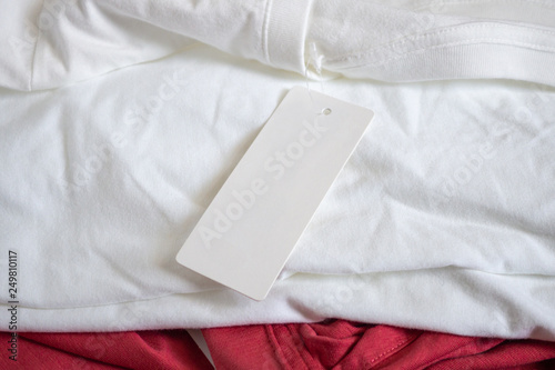 Blank price tag label on white t-shirt