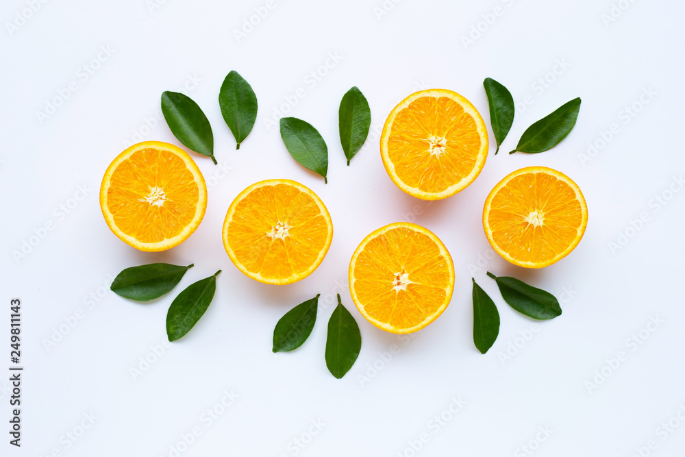 Fototapeta premium High vitamin C. Fresh orange citrus fruit with leaves isolated on white.