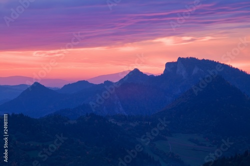 Sunrise Over Misty Landscape. Scenic View Of Foggy Morning Sky With Rising Sun Above Misty Forest. Middle Summer Nature Of Europe. Fantastic mountains landscape in Europe © Michal