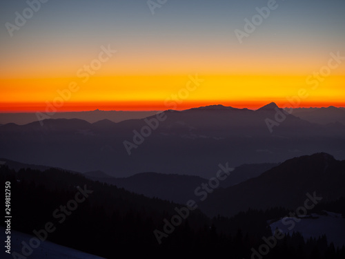 Amazing sunset at Monte Pora ski area in winter season. Landscape to the Italian Alps