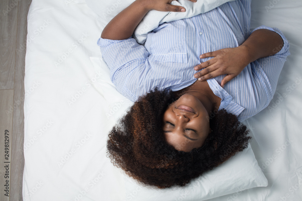 awesome woman having a pleasant dream, top view photo. good night sleep awesome woman having a pleasant dream, top view photo. good night sleep