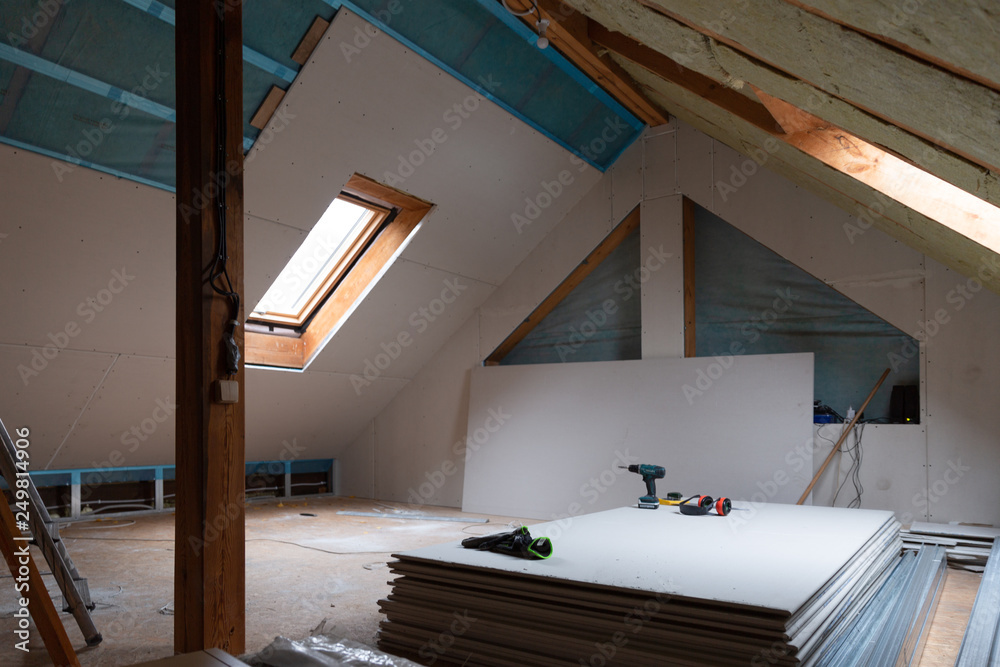 Fotografie House attic insulation and renovation. Drywall construction
