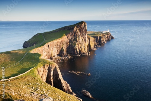 Neist Point Lighthouse near Glendale on the West Coast of the Isle of Skye in the Highlands of Scotland, UK. Most popular holidays place. Beautiful landscape background concept