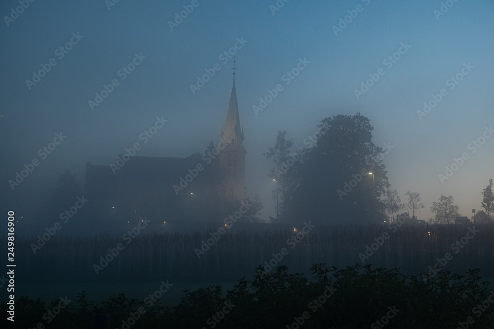 Church covered in mist