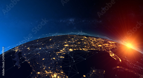 Fototapeta Naklejka Na Ścianę i Meble -  Global network concept,the rising sun over the American continent. Elements of this image furnished by NASA.