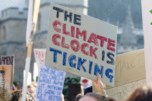 Protestors holding climate change banners at a protest photo